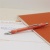Guľôčkové pero, 0,7 mm, stláčací mechanizmus, s oranžovým telom, SCHNEIDER "Epsilon XB", modré